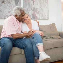 An older couple on a sofa